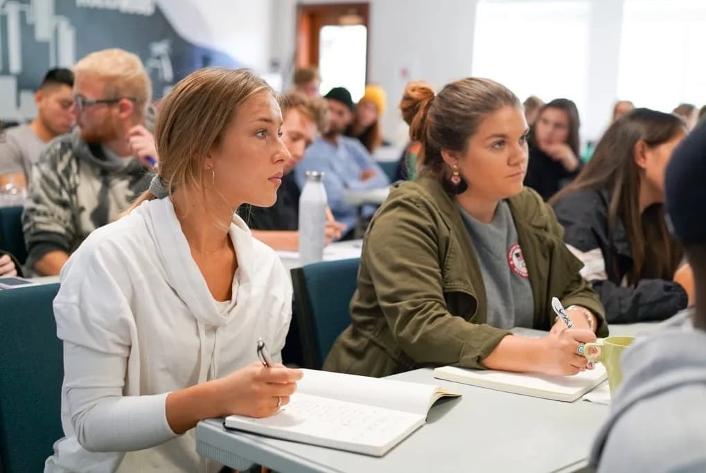 DBS students studying together in a classroom at YWAM Los Angeles