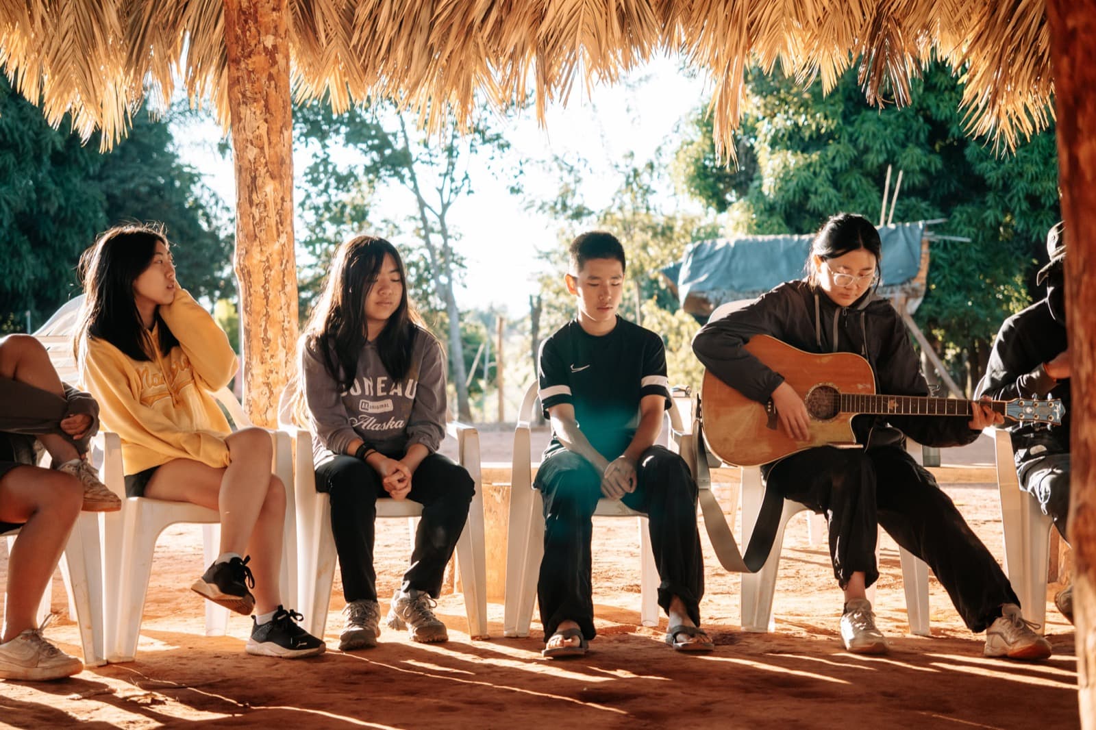 Mission Adventures students worshiping together with a guitar