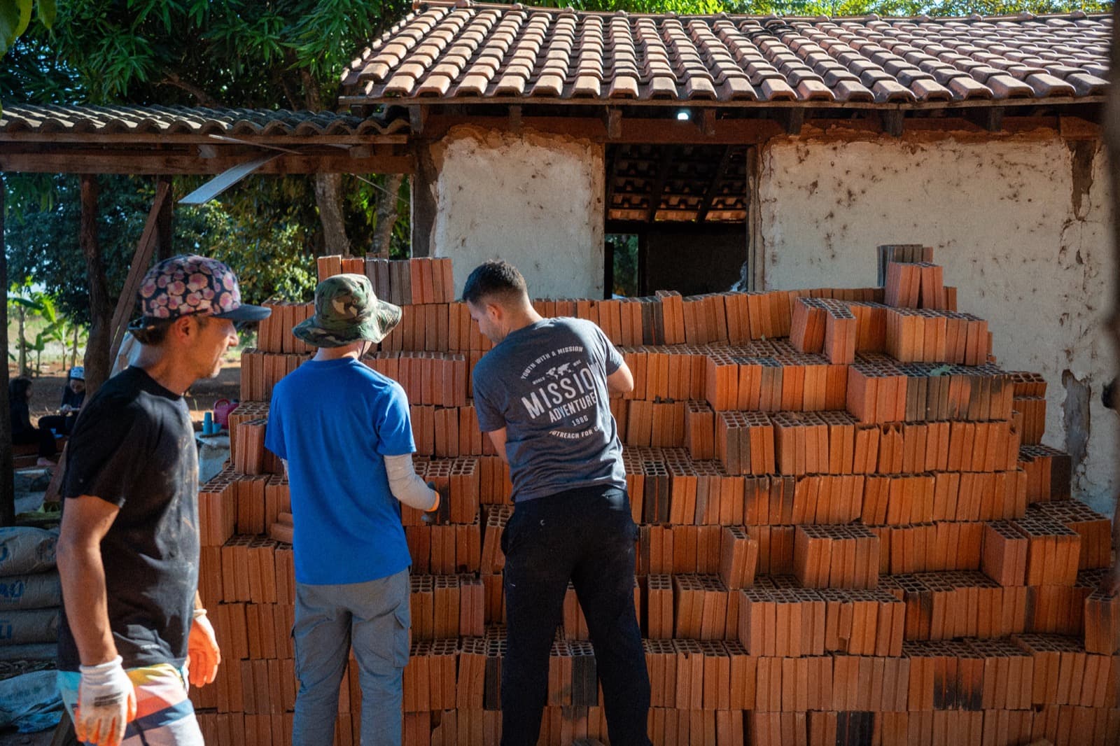 Mission Adventures volunteers preparing materials for a service project